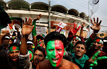 Bangladesh fans cheer outside the Shere-e-Bangla National Stadium in Dhaka prior to the World Cup opening match between Bangladesh and India on Saturday