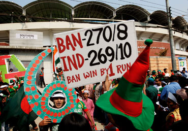 Optimistic Bangladesh fans queue to gain entry to the opening game of the World Cup between Bangladesh and India at the Shere-e-Bangla National Stadium on Saturday