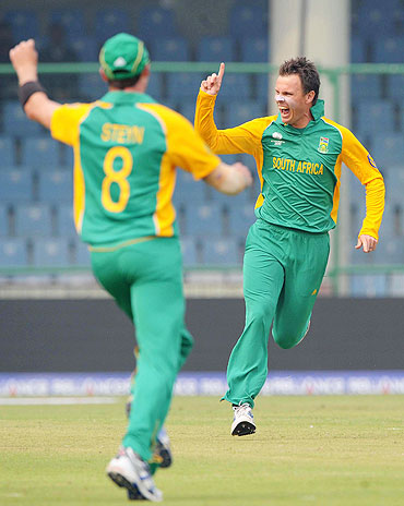 Johan Botha celebrates the wicket of Chris Gayle