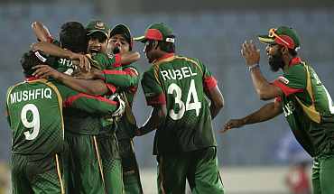 Bangladesh players celebrate after winning their match against Ireland