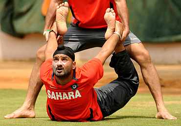 India's Harbhajan Singh stretches during a practice session in Bangalore
