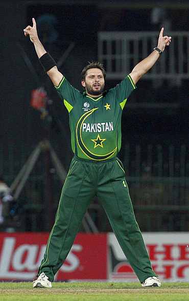 Pakistan's Shahid Afridi celebrates after taking the wicket of Sri Lanka's Tillakaratne Dilshan during their match in Colombo