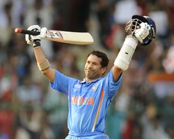 Sachin Tendulkar celebrates after getting to 100