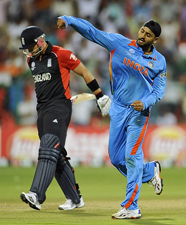 India's Harbhajan Singh (right) celebrates after dismissing England's Matt Prior
