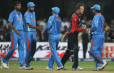 England's Graeme Swann greets Indian players after the match was tied