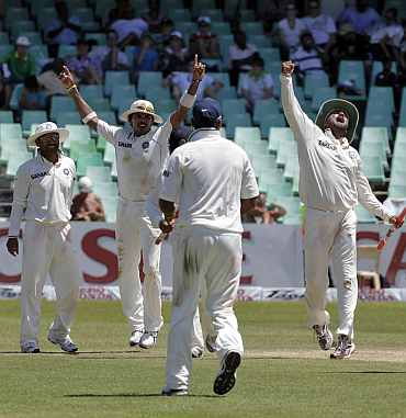 Indian players celebrate after winning the Durban Test