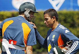 Australia's Usman Khawaja (right) and Michael Beer talk in the nets during a team practice session at the Sydney Cricket Ground on Sunday
