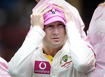 Australia's Michael Clarke reacts during a photo opportunity in support of the McGrath Foundation during a team practice session at the Sydney Cricket Ground on Sunday