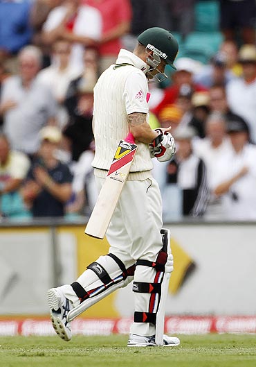 Australia's captain Michael Clarke walks off the field after being dismissed by Tim Bresnan on Monday