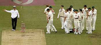 Umpire Billy Bowden signals no-ball after referring to the TV umpire the dismissal of Cook