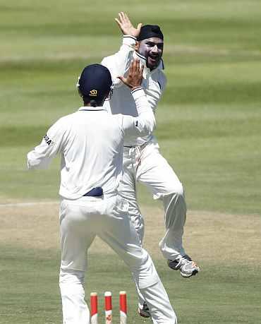 Harbhajan Singh celebrates after picking up a South African wicket at Newlands