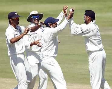 Harbhajan Singh celebrates after picking up Hashim Amla