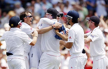 England's Kevin Pietersen (centre) is congratulated by teammates after the run-out of Watson