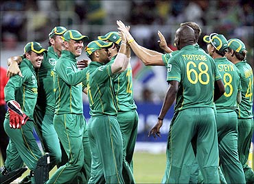 South Africa's JP Duminy (C) celebrates the wicket of India's Yuvraj Singh (not in picture) with teammates at Kingsmead