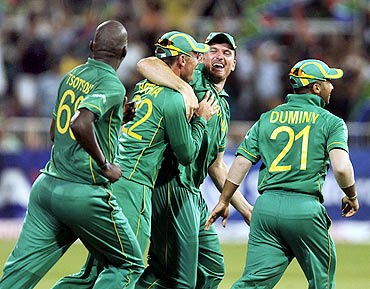 South Africa's Lonwabo Tsotsobe, Johan Botha, Graeme Smith and JP Duminy celebrate the wicket of India's Yuvraj Singh (not in picture) in Durban