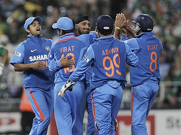 Indian players celebrate with Harbhajan Singh after dismissing South Africa's Colin Ingram on Saturday