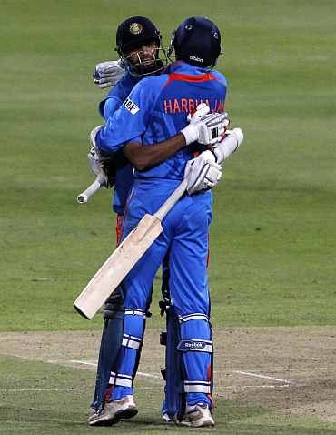 India's Ashish Nehra and Harbhajan Singh celebrate after winning the third ODI against South Africa in Cape Town