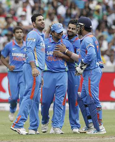 Indian players celebrate fater a fall of a South African wicket