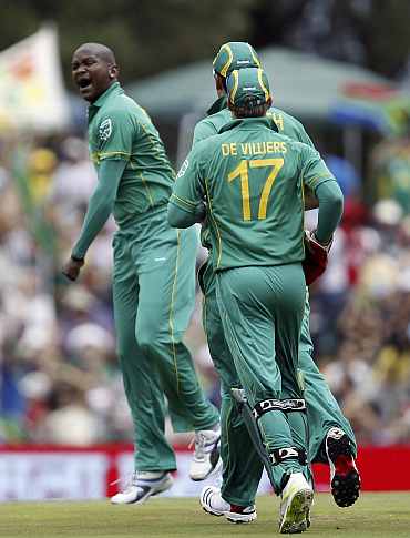 South Africa's Lonwabo Tsotsobe (L) celebrates after picking up an India wicket