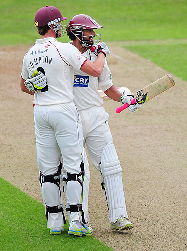 Arul Suppiah is congratulated by Nick Compton after completing his century