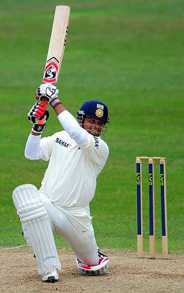 Suresh Raina hits a boundary during his knock against Somerset