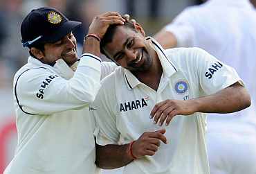 Suresh Raina congratulates Praveen Kumar after picking up five-wicket haul