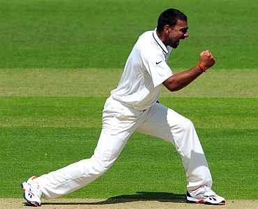 Praveen Kumar celebrates after picking up a wicket