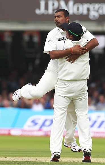 Praveen Kumar celebrates after picking up a wicket