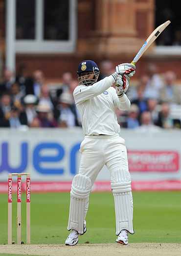 Praveen Kumar hits a boundary during his knock against England
