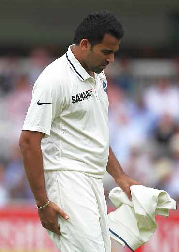 Zaheer walks off after pulling his hamstring during the Lord's Test