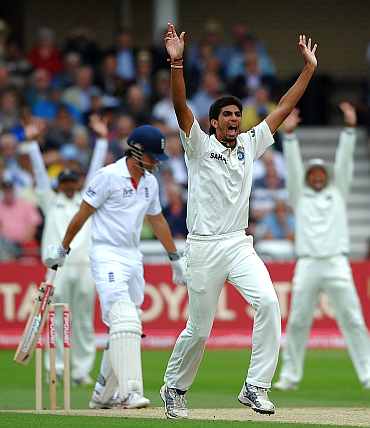 Ishant Sharma successfully appeals for the wicket of Alastair Cook
