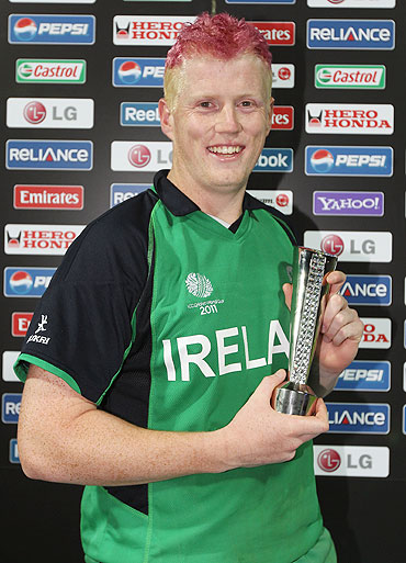 Kevin O'Brien of Ireland poses with the man of the match trophy