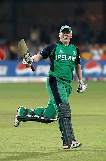 Kevin O'Brien celebrates after reaching his century