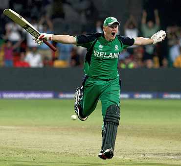 Kevin O'Brien celebrates after reaching his century against England