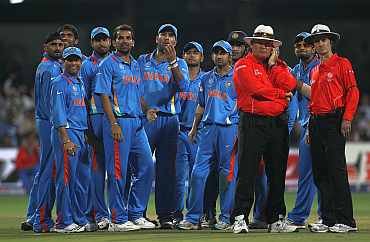 The Indians wait for the third umpire's decision on Ian Bell on Sunday