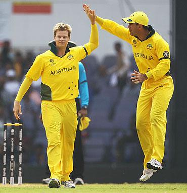 Ricky Ponting celebrates with Steven Smith (left)