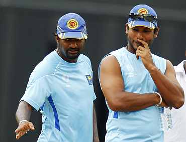 Sri Lanka skipper Kumar Sangakkara and Muralitharan during a practice session