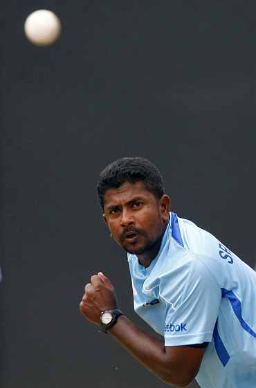 Rangana Herath bowls during a practice session in Colombo