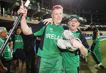 Kevin O'brien celebrates with Nail O'brien after winning his match against England