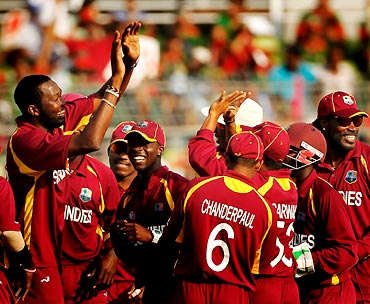 Sulieman Benn celebrates with team mates after taking the wicket of Rubel Hossain