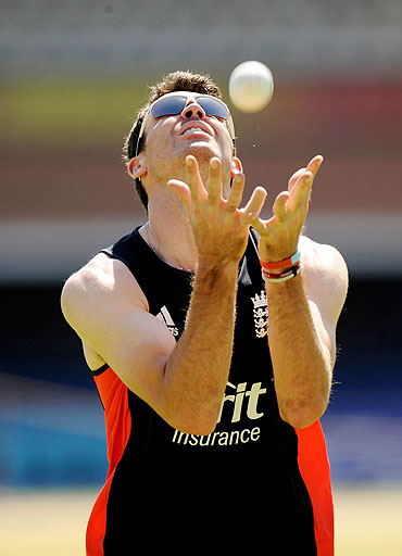 England's James Anderson takes a catch during a practice session