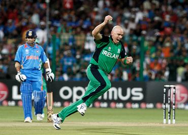 Trent Johnston celebrates a caught and bowled from Sehwag