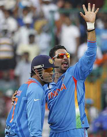 Yuvraj Singh celebrates after picking up a five-wicket haul against Ireland on Sunday