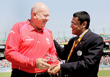 Umpire Steve Davis is presented a memento by Ranjan Madugalle of the Emirates Elite Panel of ICC Match Referees, to mark his 100th One Day International match on Wednesday