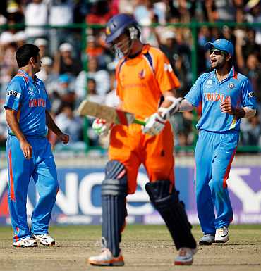 India's Piyush Chawla celebrates after picking up the wicket of Eric Szwarczynski