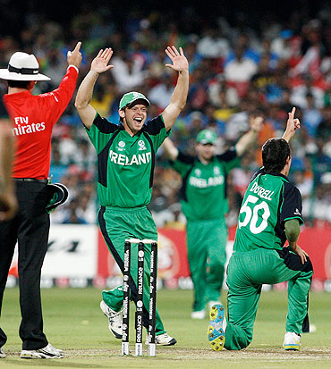 Ireland's George Dockrell (right) celebrates with Ed Joyce after dismissing India's Sachin Tendulkar LBW for 38