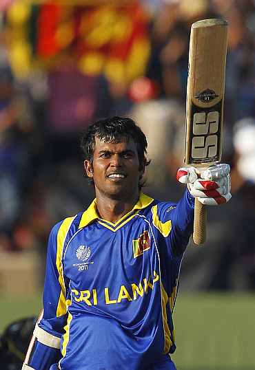 Sri Lanka Upul Tharanga celebrates after completing his century against Zimbabwe