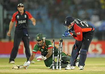 Bangladesh's Imrul Kayes is run out next to England's wicketkeeper Matt Prior during the ICC Cricket World Cup group B match in Chittagong