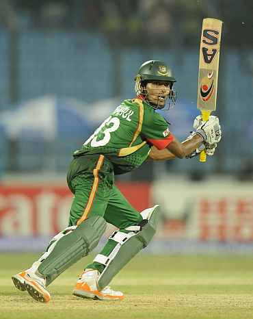 Bangladesh's Shafiul Islam plays a shot during his match against England
