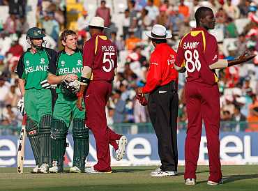 Ireland's Gary Wilson speaks to umpire after he was given out